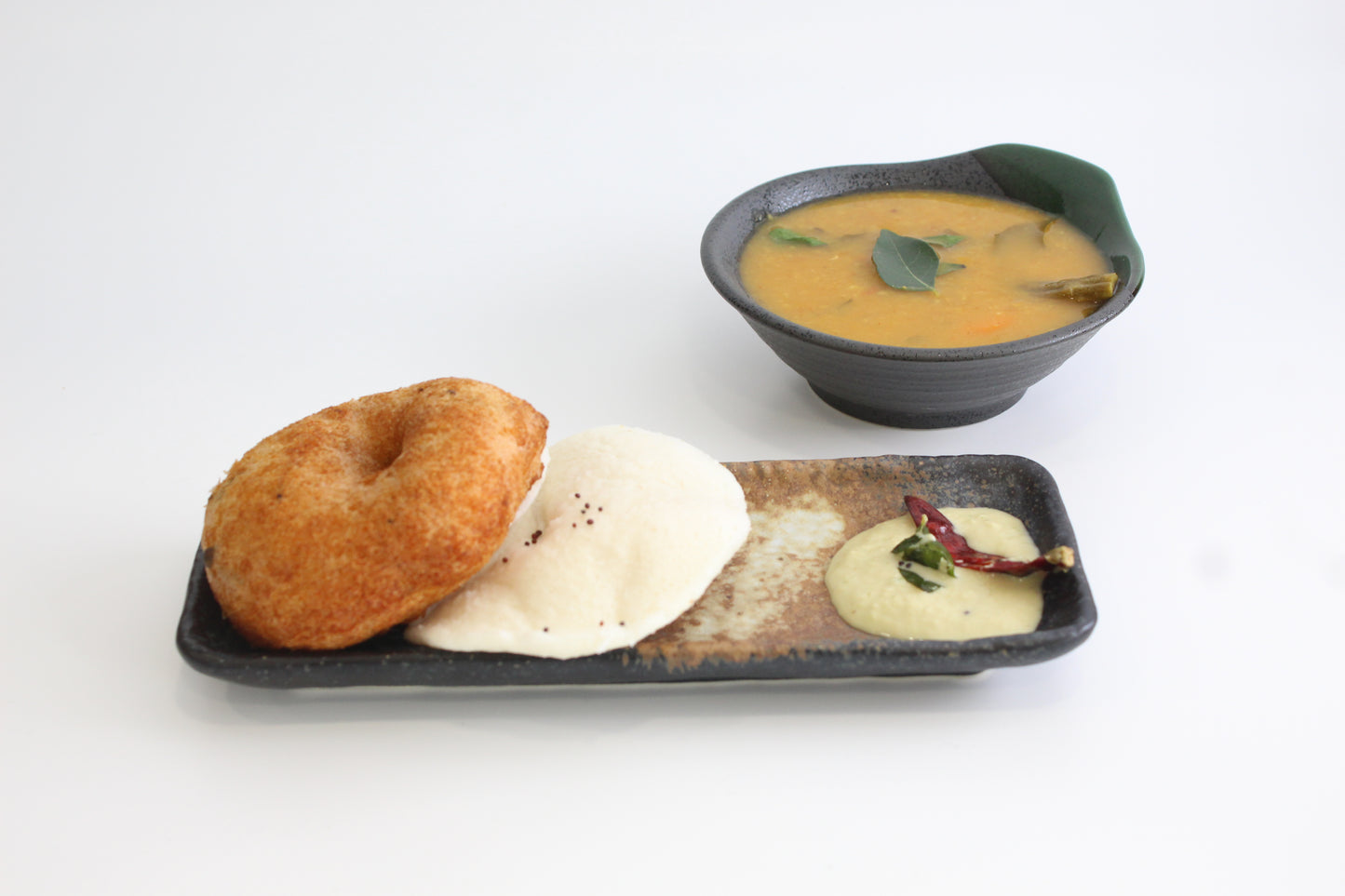 yellow & gray stoneware rectangular snack plate with South Indian food