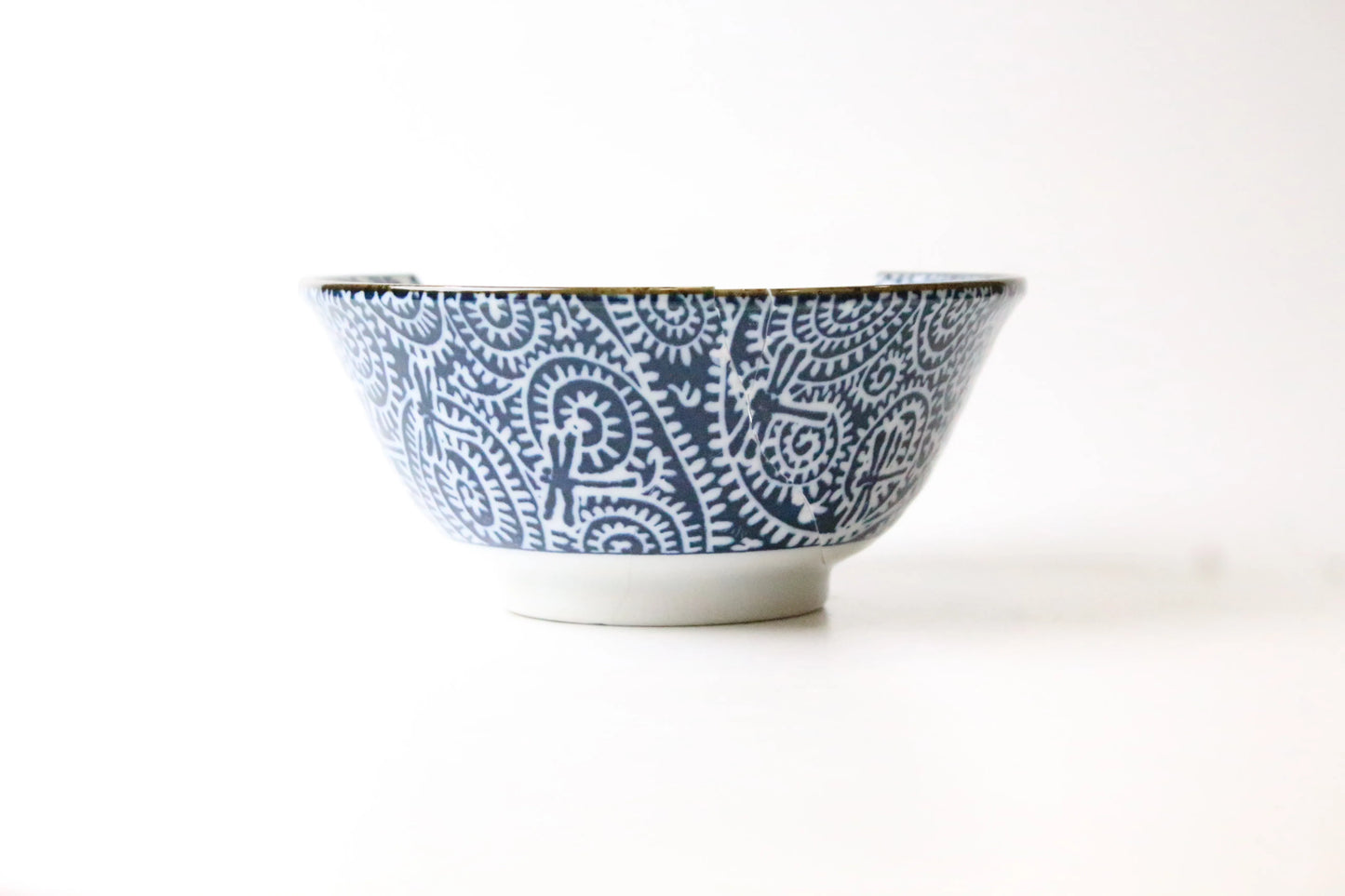 Japanese porcelain rice bowl featuring dragonflies, accented with blue and white details.