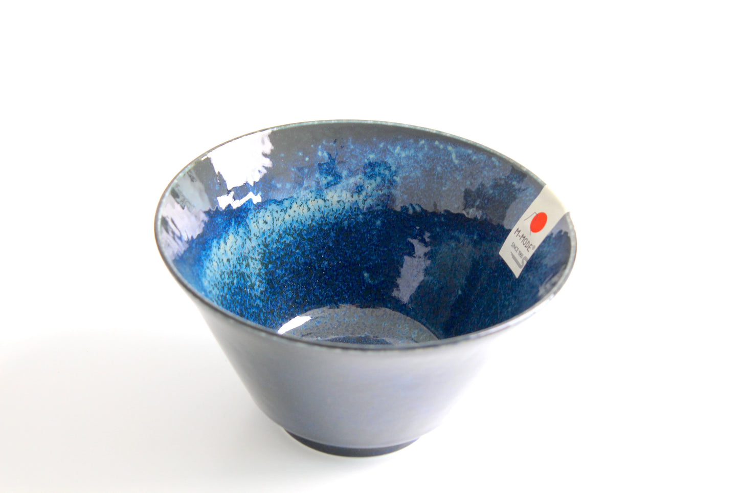 An inverted conical ramen bowl with a deep, glossy midnight-blue glaze, showcasing the small circular foot ring at its base.