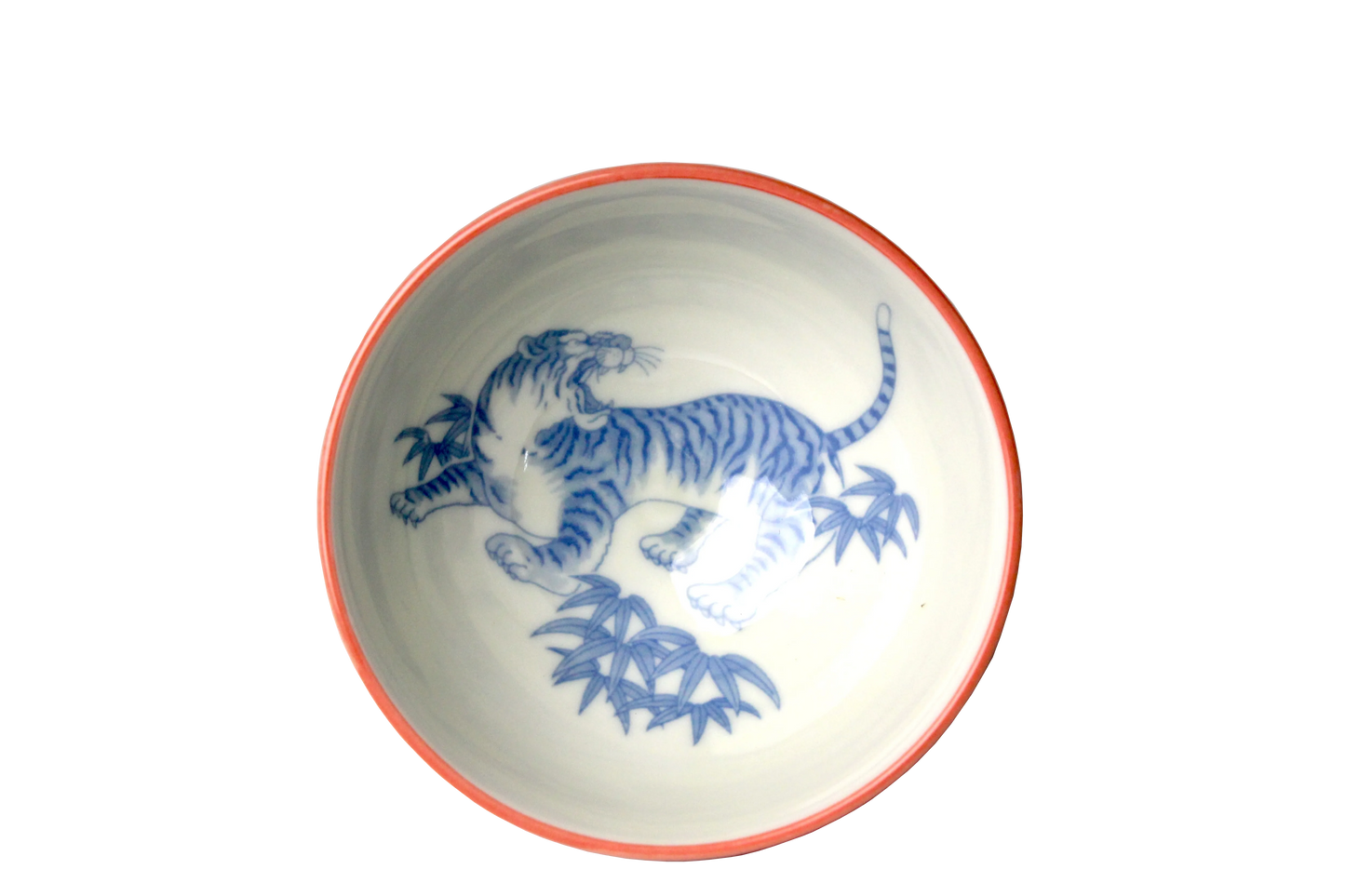 Traditional Japanese rice bowl with a roaring tiger in blue imprinted inside