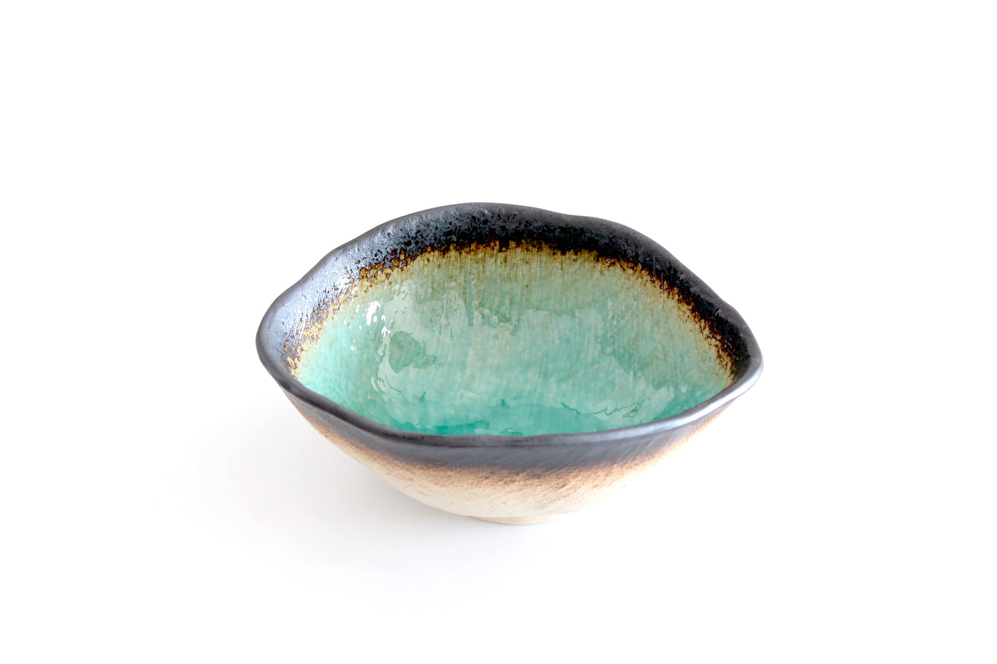 Multi-purpose ceramic bowl with a soothing turquoise interior that fades into earthy browns and blacks, inspired by the hot sulfur springs of Beppu Onsen.