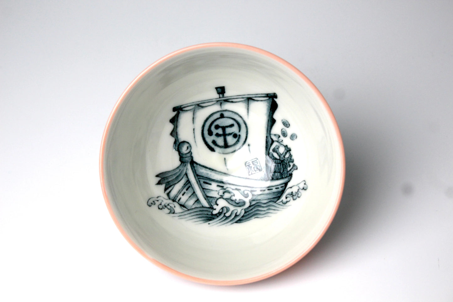 Japanese rice bowl featuring a boat beautifully illustrated inside the bowl