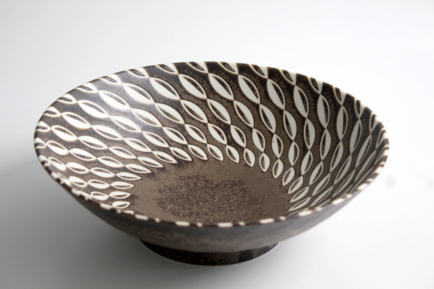 Rustic brown salad bowl with a white leaf pattern and a matte finish, inspired by traditional Iga-yaki pottery.