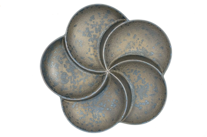 top view of a bronze, 5-section divided plate shaped like a flower petals.