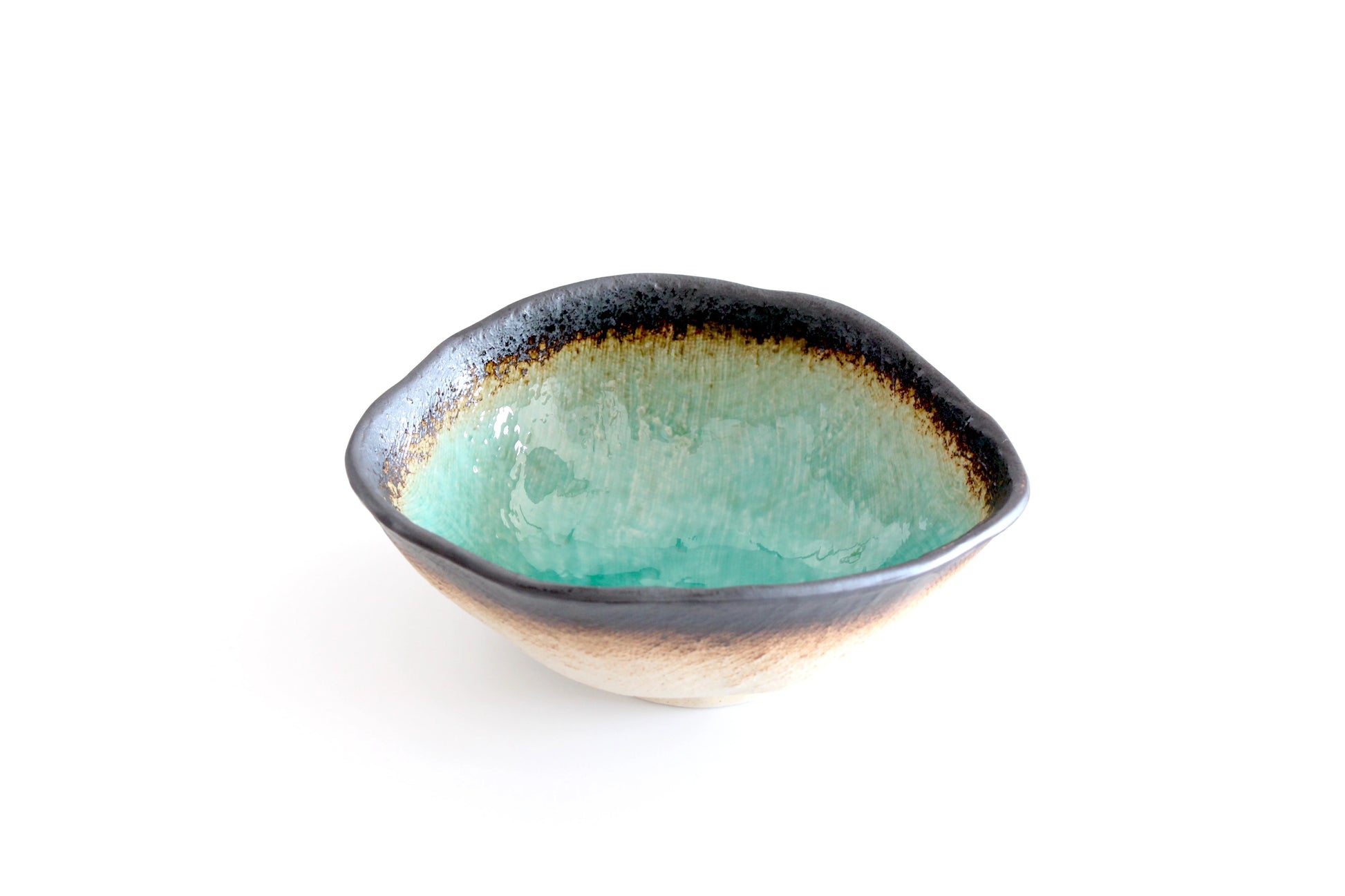 Multi-purpose ceramic bowl with a soothing turquoise interior that fades into earthy browns and blacks, inspired by the hot sulfur springs of Beppu Onsen.