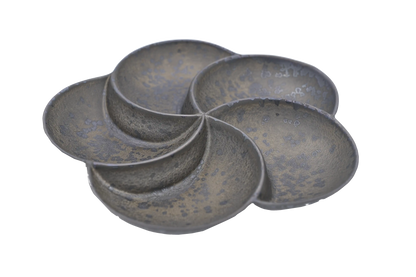 Isometric view of a bronze, 5-section divided plate shaped like a flower petals.
