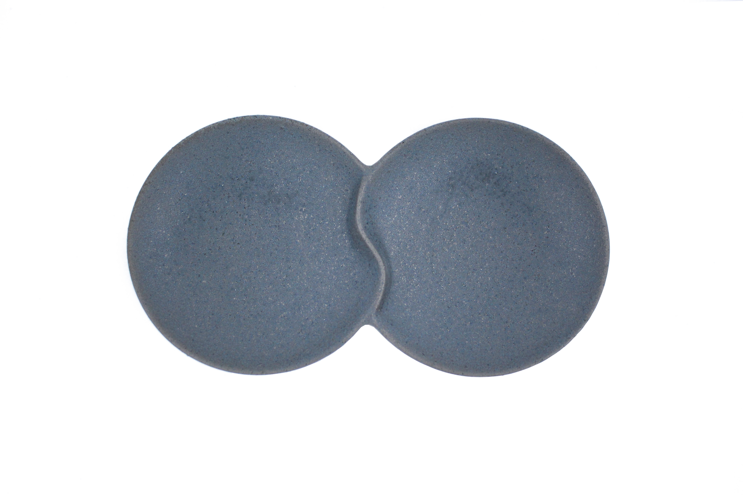 A top-down view of the Missera Hotate, a matte black ceramic divided serving dish with two circular sections joined in the center like a clam shell. Perfect as a multi compartment serving dish for snacks and dips.