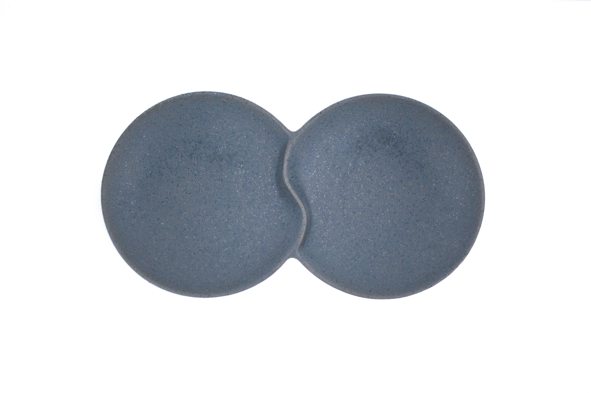 A top-down view of the Missera Hotate, a matte black ceramic divided serving dish with two circular sections joined in the center like a clam shell. Perfect as a multi compartment serving dish for snacks and dips.