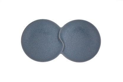 A top-down view of the Missera Hotate, a matte black ceramic divided serving dish with two circular sections joined in the center like a clam shell. Perfect as a multi compartment serving dish for snacks and dips.