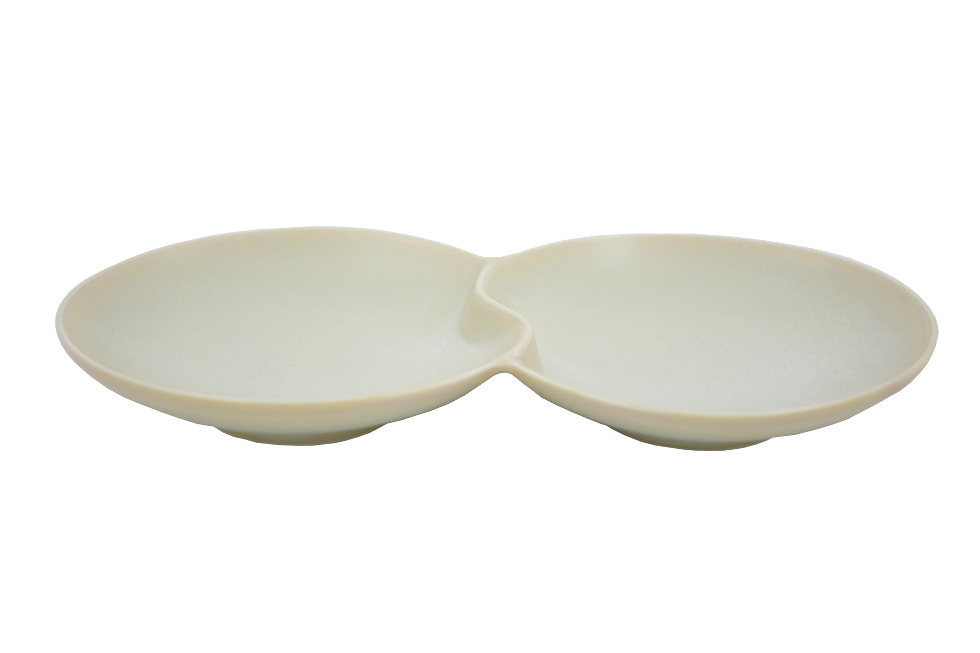 An isometric view of the Missera Hotate, a cream ceramic divided serving dish with two circular sections joined in the center like a clam shell. Perfect as a multi compartment serving dish for snacks and dips.
