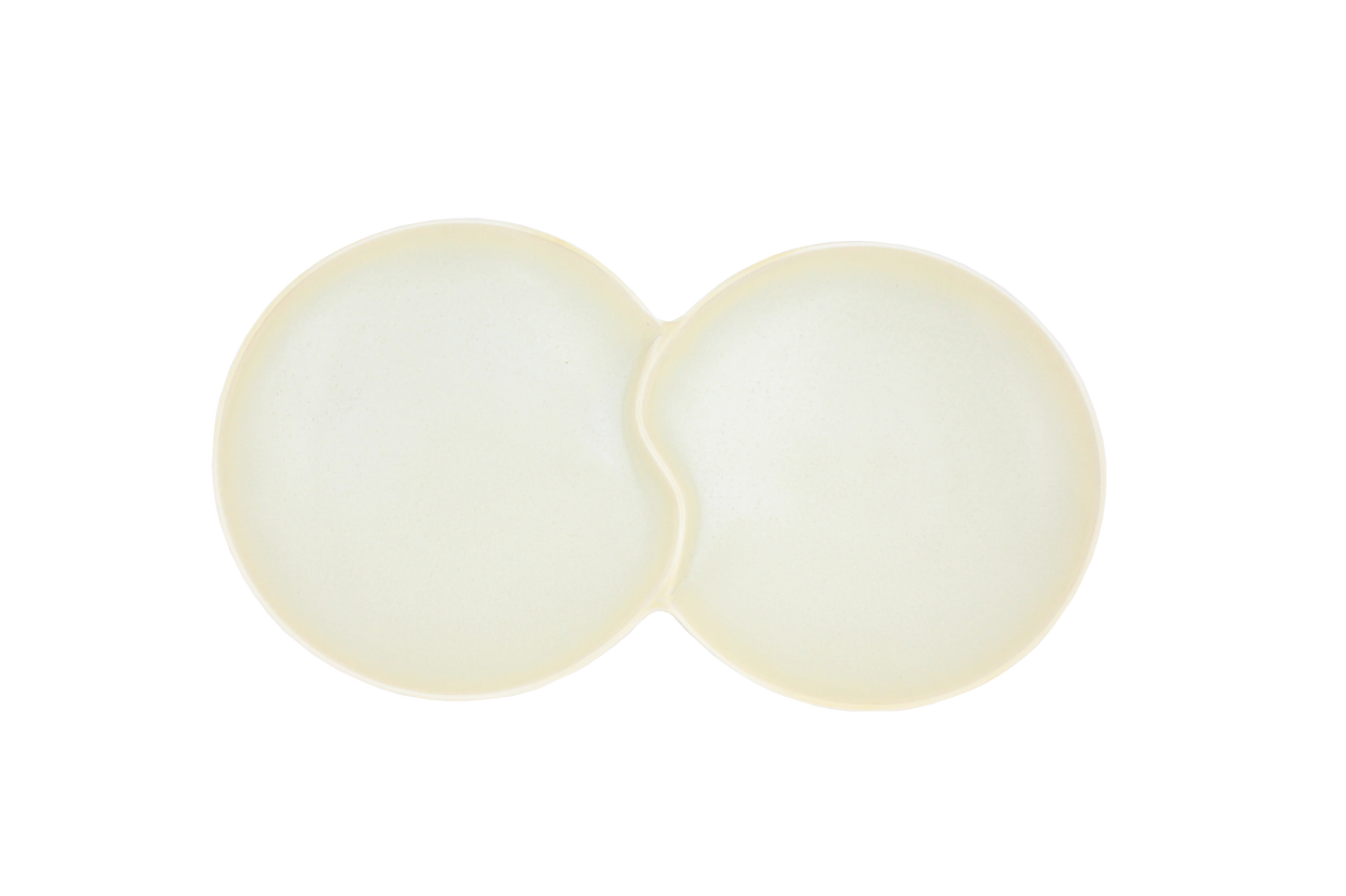 A top-down view of the Missera Hotate, a cream ceramic divided serving dish with two circular sections joined in the center like a clam shell. Perfect as a multi compartment serving dish for snacks and dips.