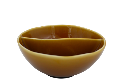 An isometric view of the Missera Kari, an amber colored divided bowl