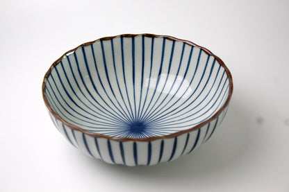 A Japanese ceramic bowl featuring a delicate radial Sensu (fan) pattern in deep blue, with a scalloped rim and a glossy finish.